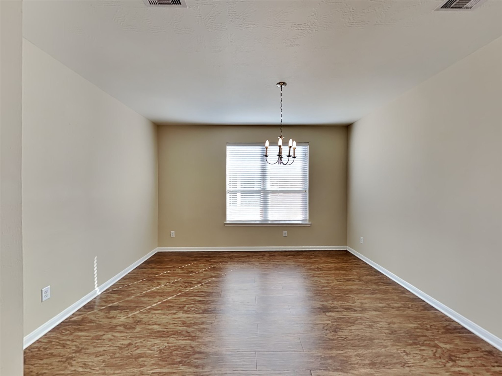 19022 Walbrook Meadows Lane Cypress, TX 77433 - Photo 5 of 23 a view of an empty room with wooden floor and a window