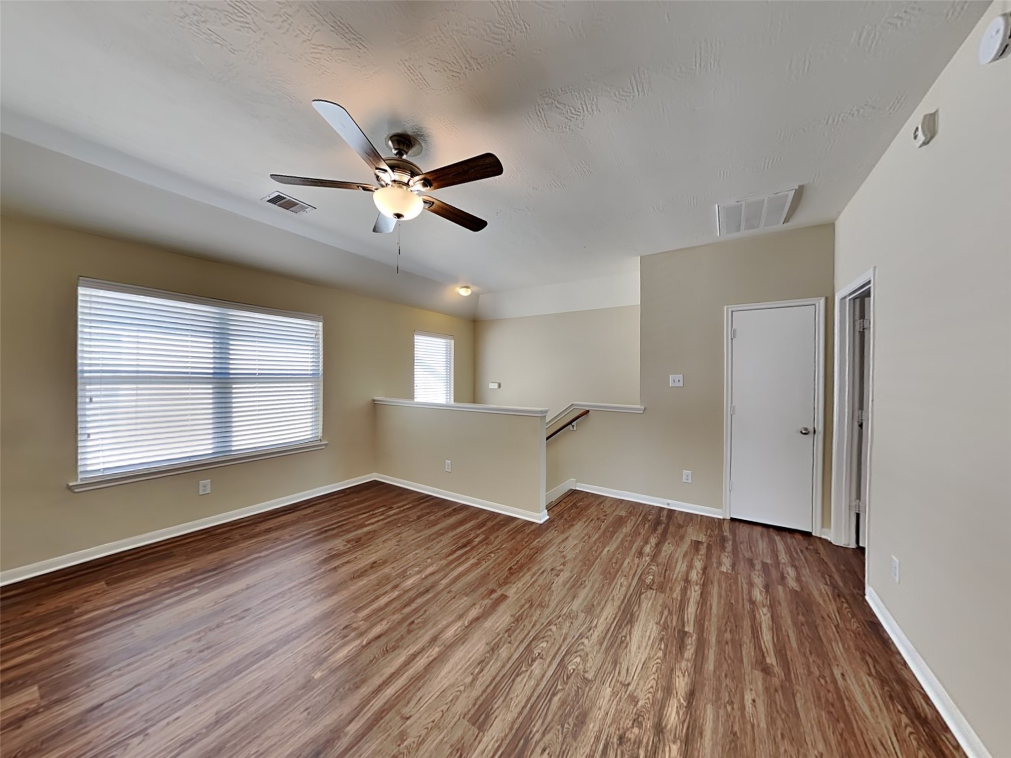 19022 Walbrook Meadows Lane Cypress, TX 77433 - Photo 9 of 23 a view of empty room with wooden floor and fan