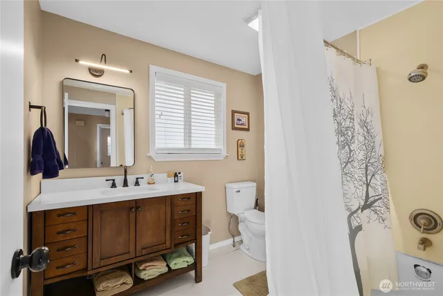 a bathroom with a sink double vanity and a mirror