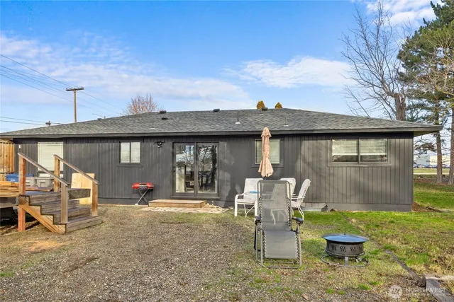 a view of a chairs and table in patio