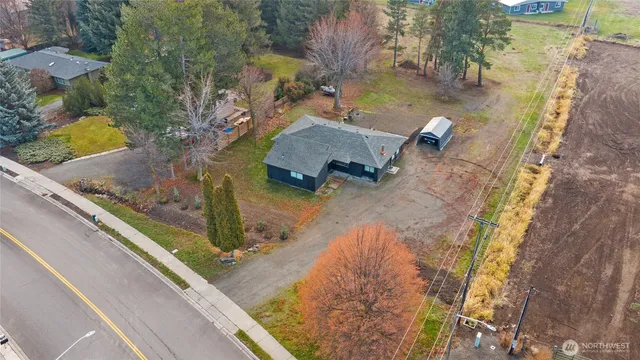 an aerial view of a house with a yard