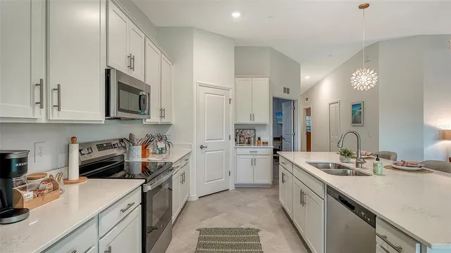 an aerial view of a house with a swimming pool yard and outdoor seating
