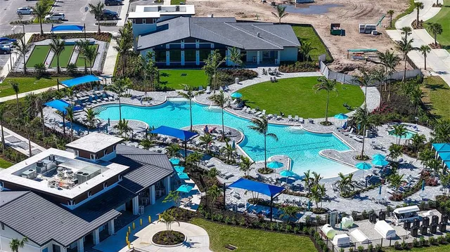 a view of swimming pool with a lounge chair