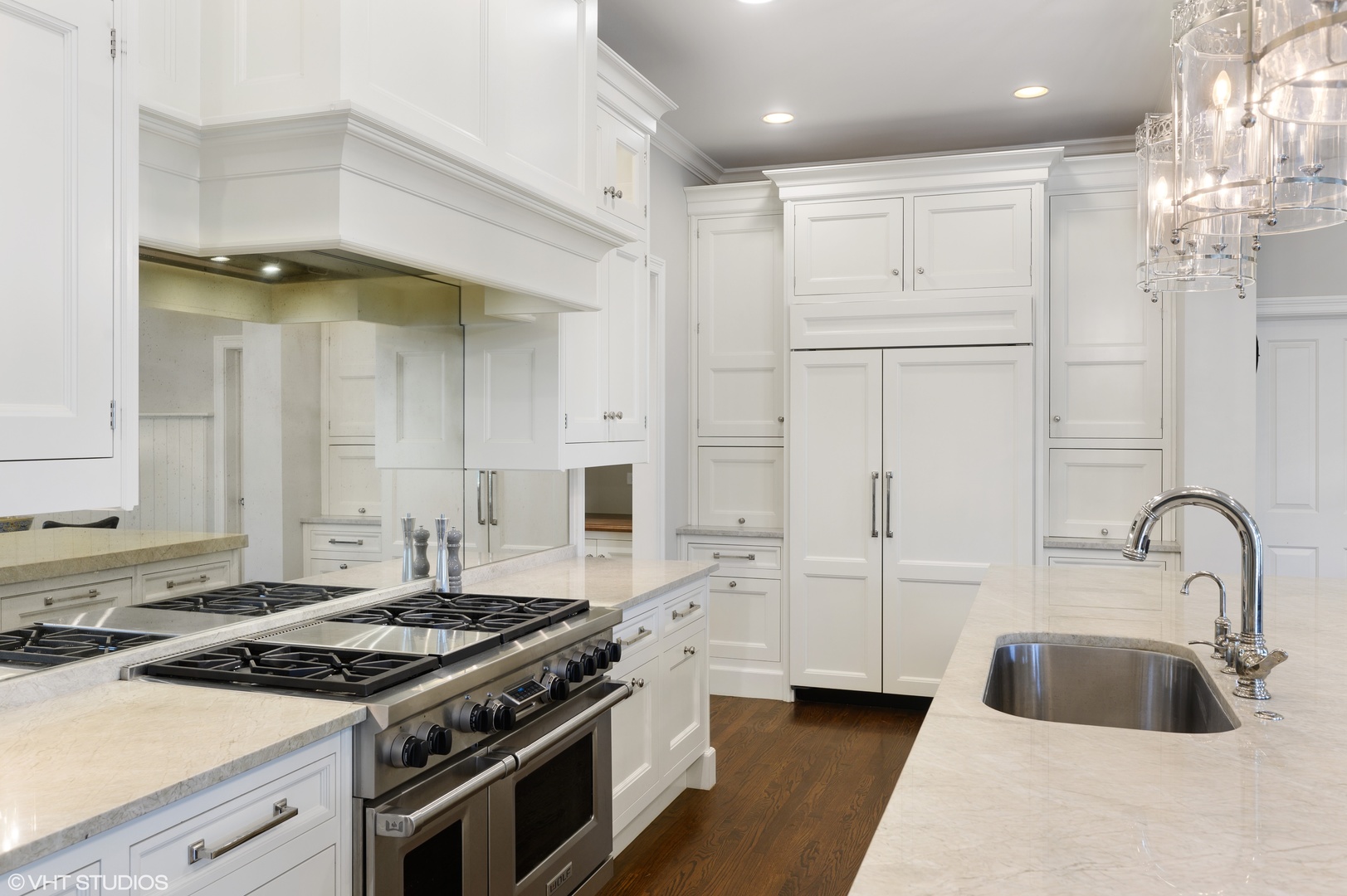909 Windsor Road Glenview, IL 60025 - Photo 12 of 47 a kitchen with white cabinets and appliances