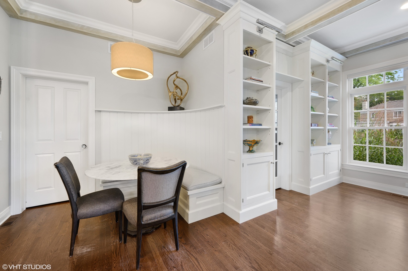 909 Windsor Road Glenview, IL 60025 - Photo 13 of 47 a view of a dining room with furniture and wooden floor