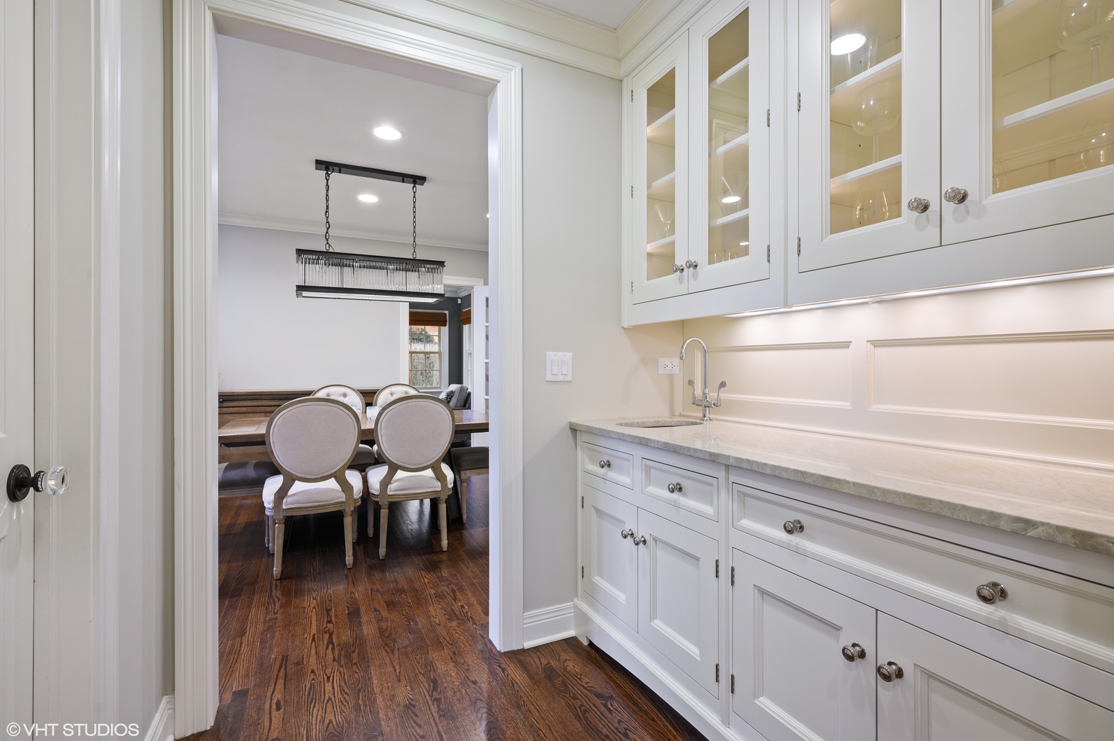 909 Windsor Road Glenview, IL 60025 - Photo 16 of 47 a kitchen with cabinets and wooden floor