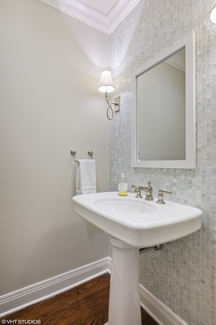 909 Windsor Road Glenview, IL 60025 - Photo 21 of 47 a bathroom with a sink and a mirror