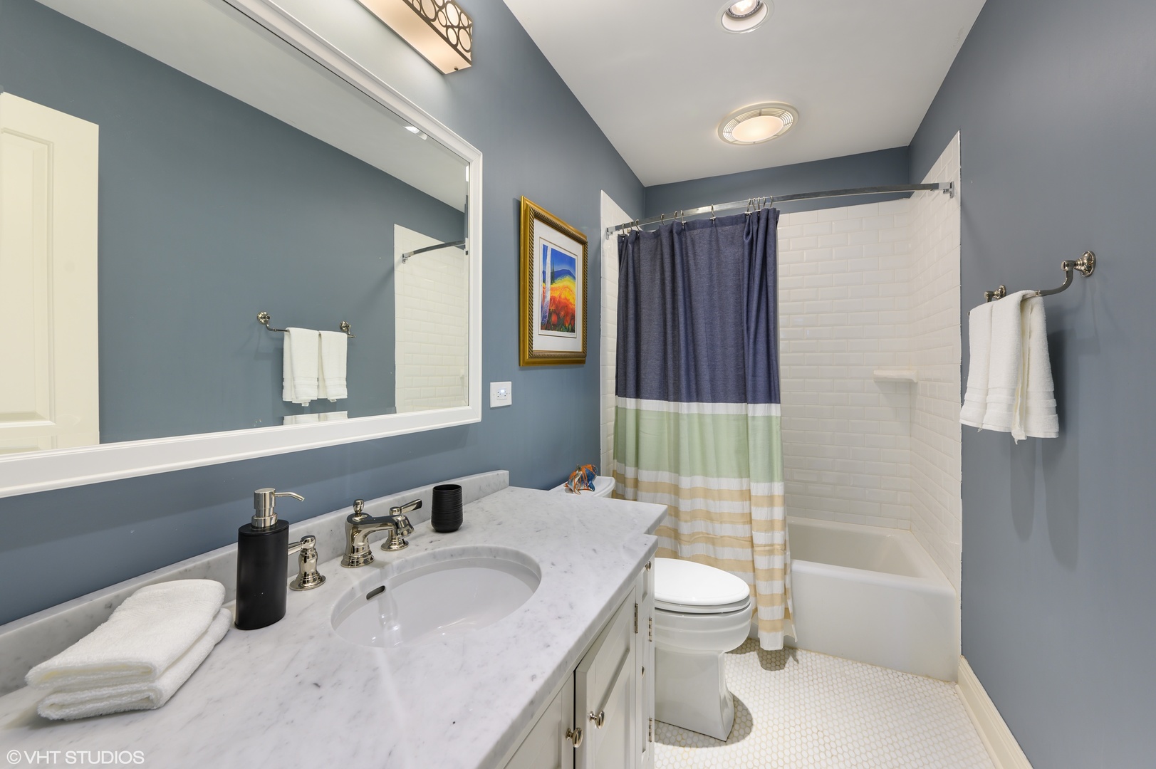 909 Windsor Road Glenview, IL 60025 - Photo 32 of 47 a bathroom with a sink toilet tub and shower