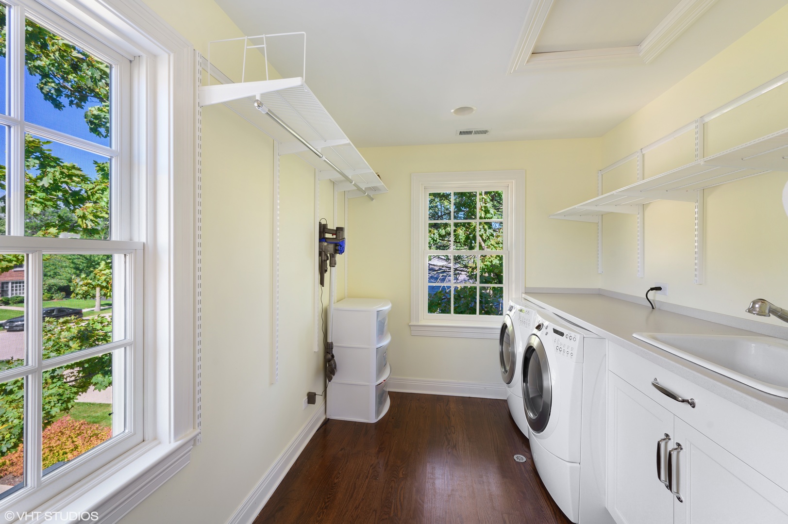 909 Windsor Road Glenview, IL 60025 - Photo 34 of 47 a view of a kitchen with a sink dishwasher a refrigerator and a window