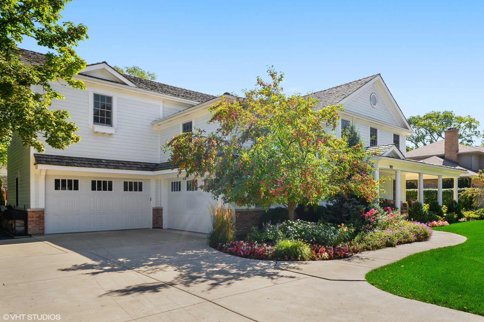 909 Windsor Road Glenview, IL 60025 - Photo 38 of 47 a front view of a house with a yard and potted plants