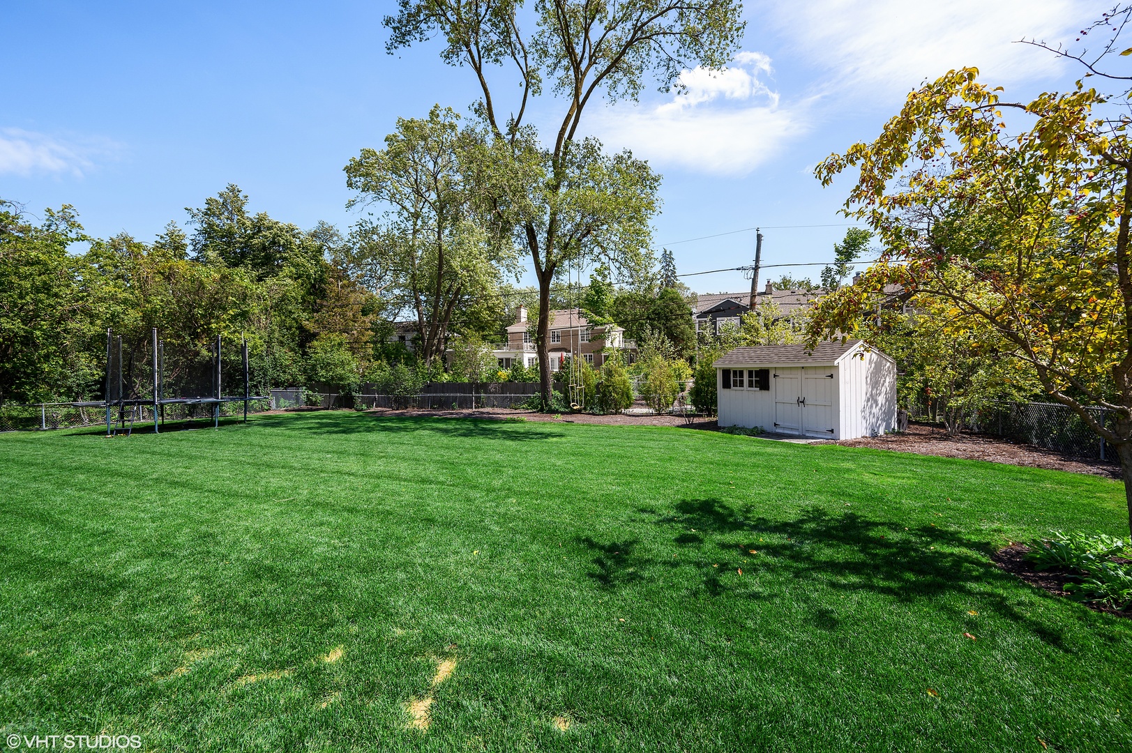 909 Windsor Road Glenview, IL 60025 - Photo 44 of 47 a view of a backyard with large trees
