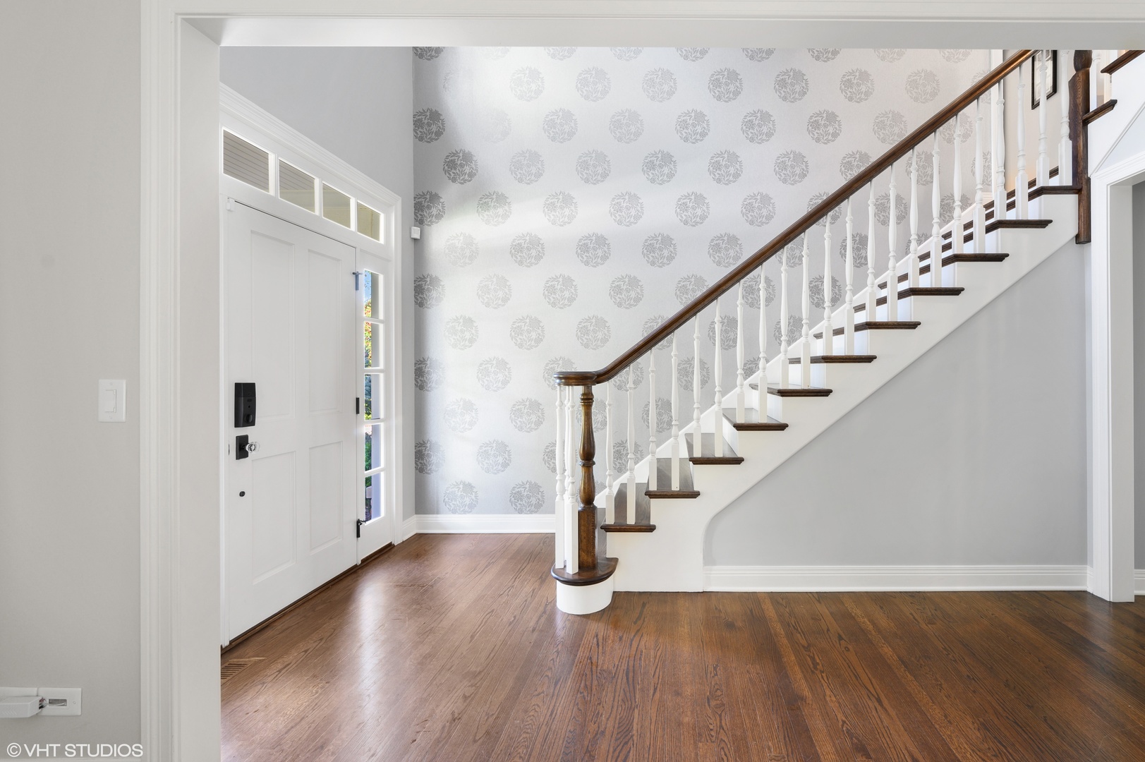909 Windsor Road Glenview, IL 60025 - Photo 7 of 47 a view of entryway with wooden floor