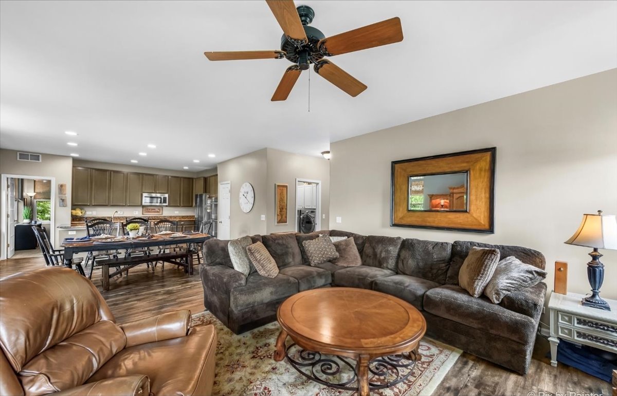 237 Foxford Drive Cary, IL 60013 - Photo 14 of 66 a living room with furniture a rug and a chandelier