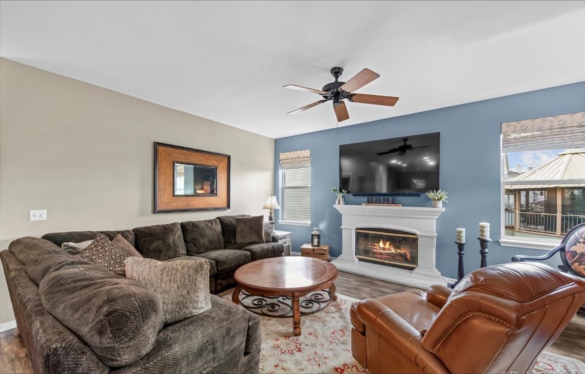 237 Foxford Drive Cary, IL 60013 - Photo 16 of 66 a living room with furniture a flat screen tv and a fireplace