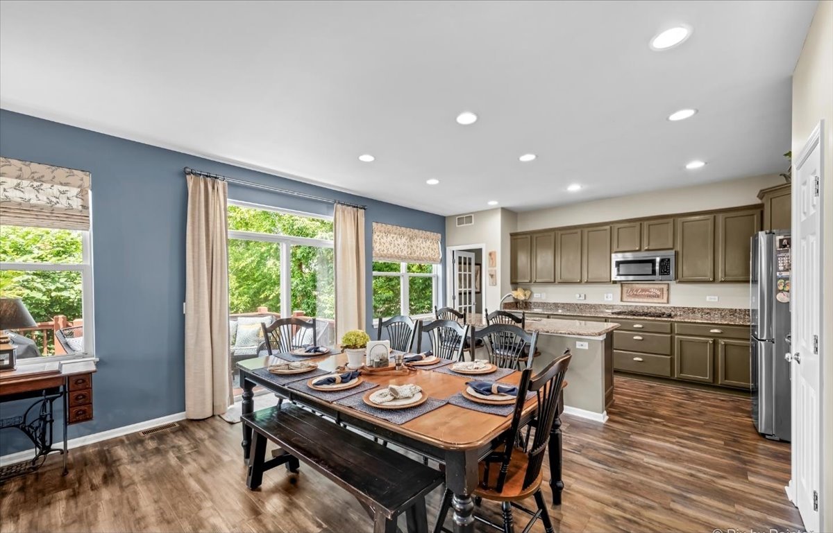 237 Foxford Drive Cary, IL 60013 - Photo 17 of 66 a view of a dining room with furniture window and outside view