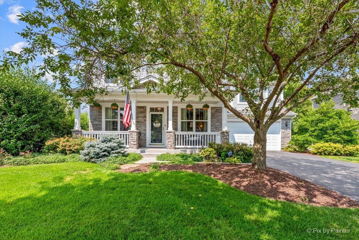 237 Foxford Drive Cary, IL 60013 - Photo 2 of 66 a front view of a house with a garden