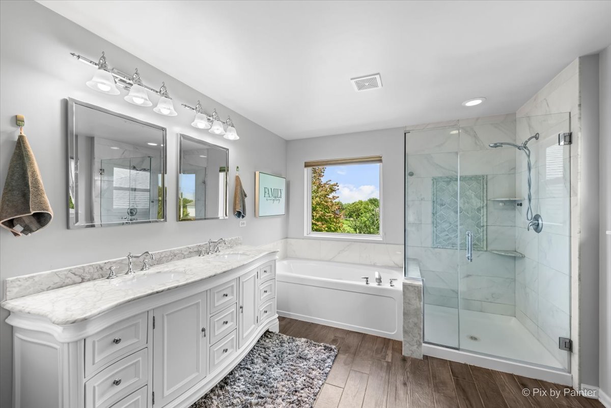 237 Foxford Drive Cary, IL 60013 - Photo 32 of 66 a bathroom with a granite countertop sink mirror and shower