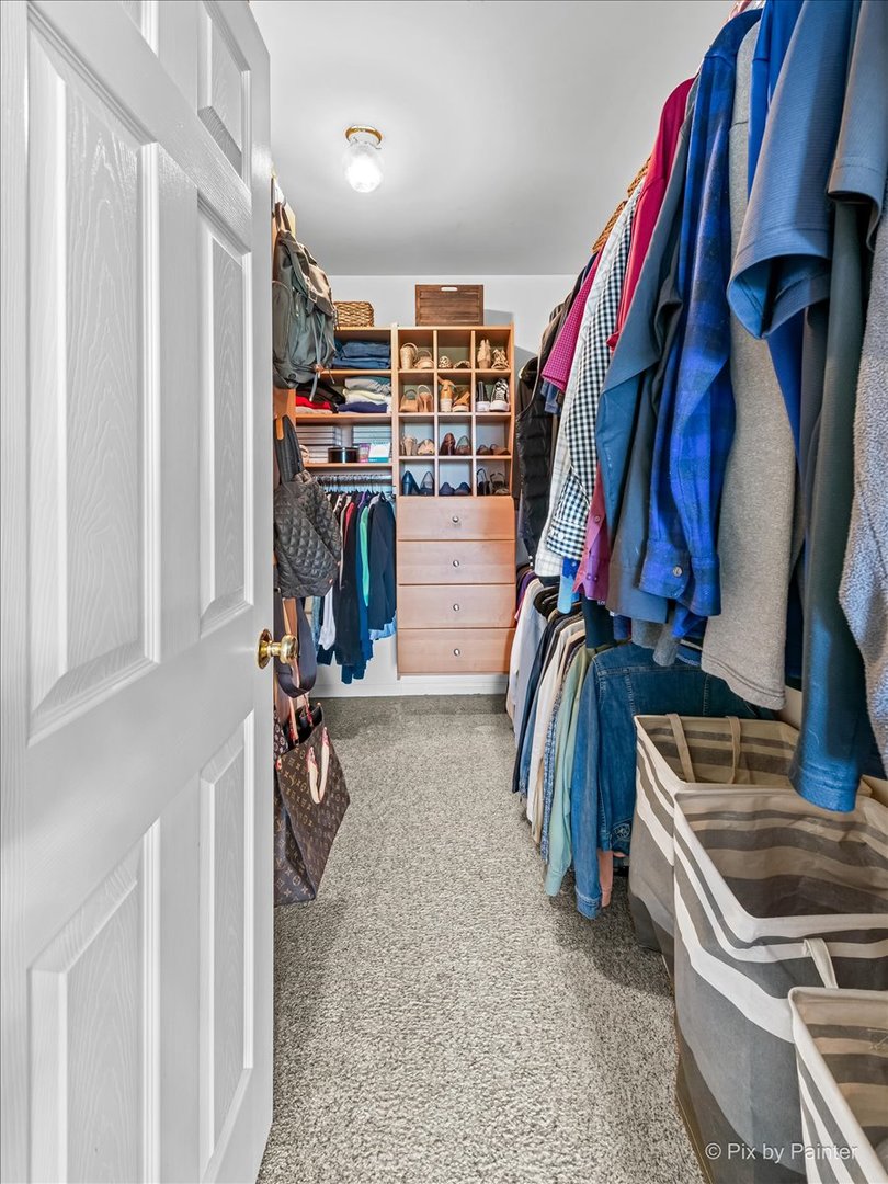 237 Foxford Drive Cary, IL 60013 - Photo 36 of 66 a view of walk in closet with clothes and shoes