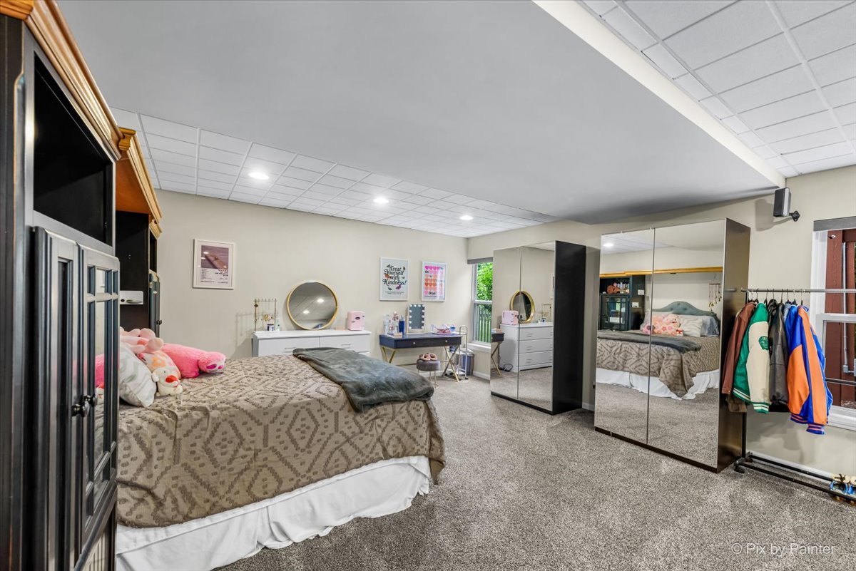 237 Foxford Drive Cary, IL 60013 - Photo 51 of 66 a bed room with a bed and a flat screen tv