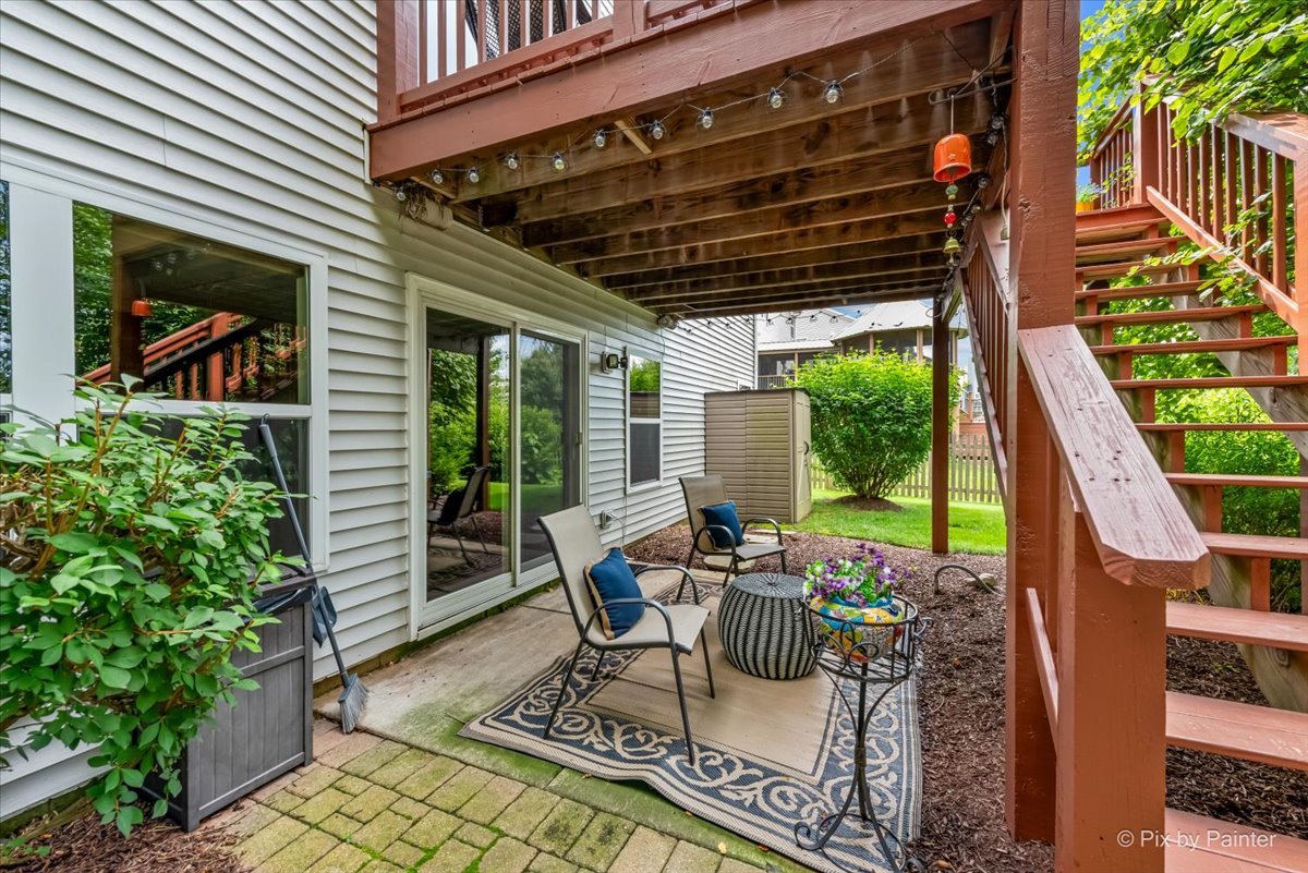 237 Foxford Drive Cary, IL 60013 - Photo 58 of 66 a view of a patio with table and chairs and potted plants