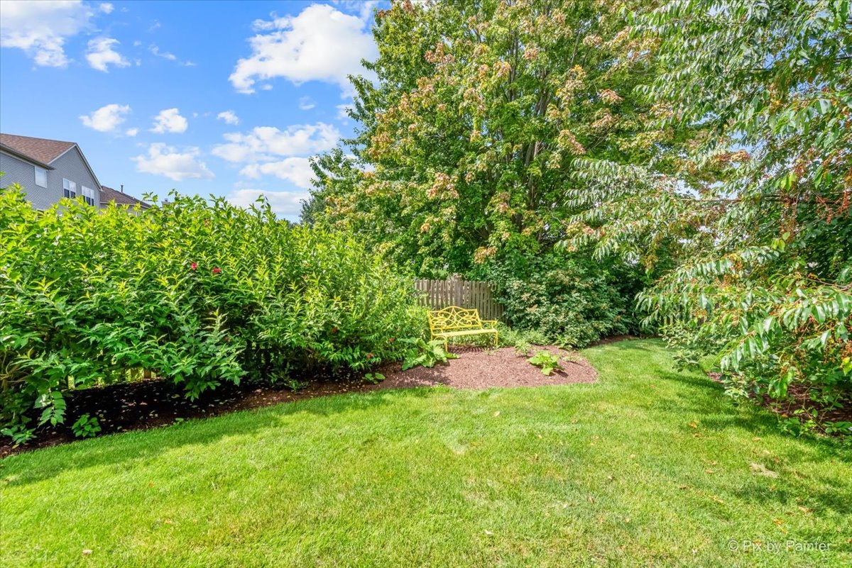 237 Foxford Drive Cary, IL 60013 - Photo 65 of 66 a backyard of a house with lots of green space