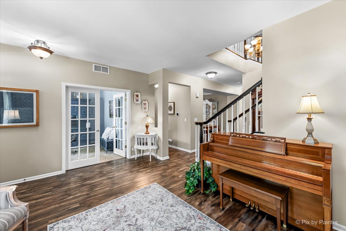 237 Foxford Drive Cary, IL 60013 - Photo 9 of 66 a view of entryway and hall with wooden floor