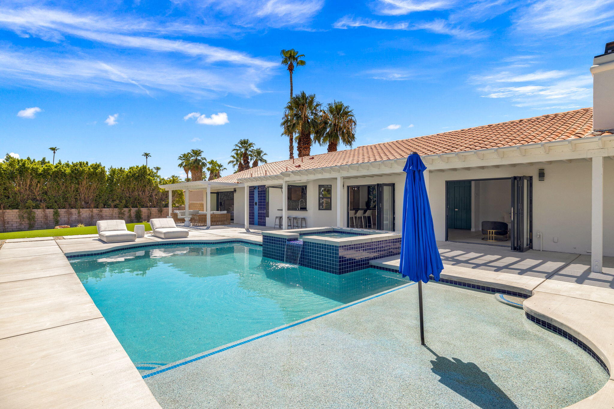 72278 Barbara Drive Rancho Mirage, CA 92270 - Photo 18 of 69 a view of a house with swimming pool and sitting area
