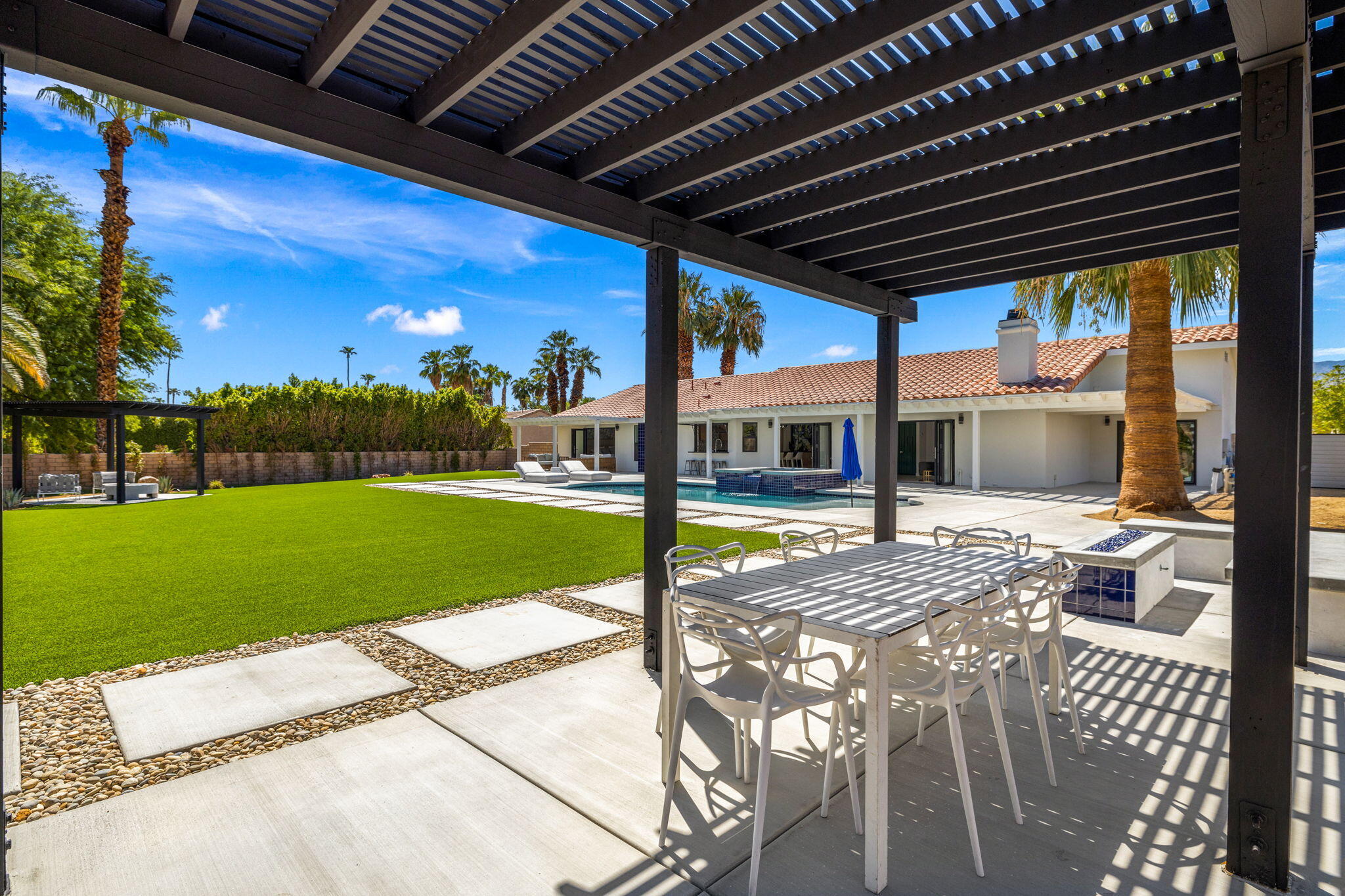 72278 Barbara Drive Rancho Mirage, CA 92270 - Photo 22 of 69 a view of a porch with furniture and garden