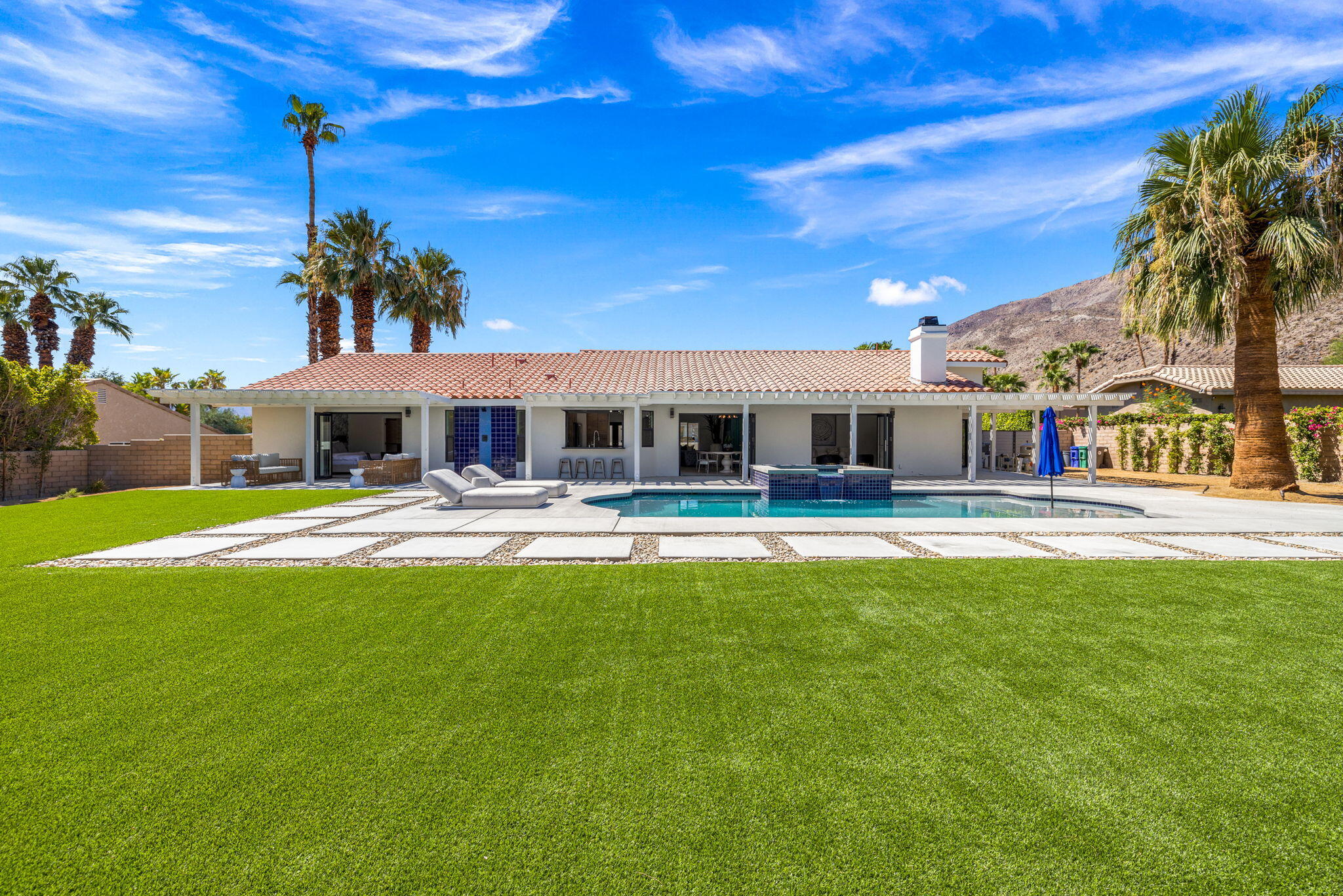 72278 Barbara Drive Rancho Mirage, CA 92270 - Photo 25 of 69 a house view with a sitting space and garden view
