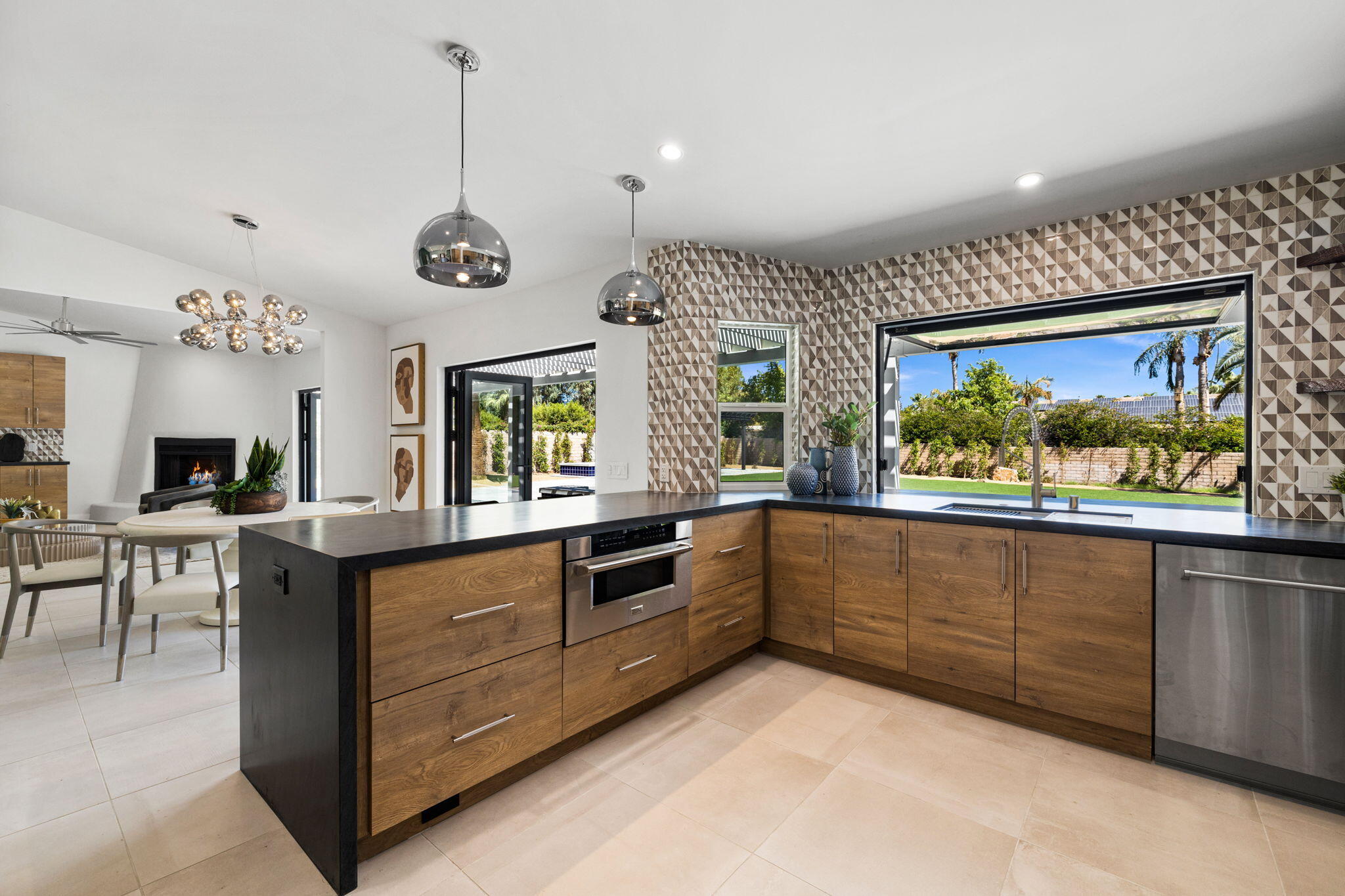 72278 Barbara Drive Rancho Mirage, CA 92270 - Photo 48 of 69 a large kitchen with stainless steel appliances granite countertop a stove and a sink
