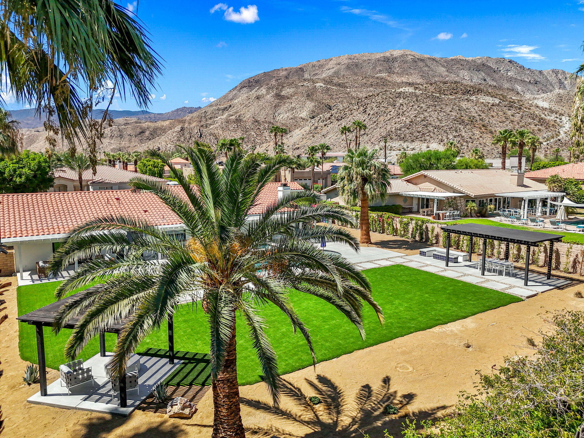 72278 Barbara Drive Rancho Mirage, CA 92270 - Photo 5 of 69 a view of a garden with a building in the background