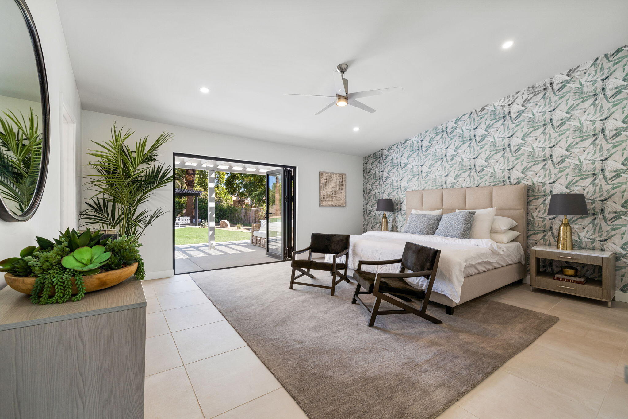 72278 Barbara Drive Rancho Mirage, CA 92270 - Photo 66 of 69 a spacious bedroom with a large bed and a potted plant