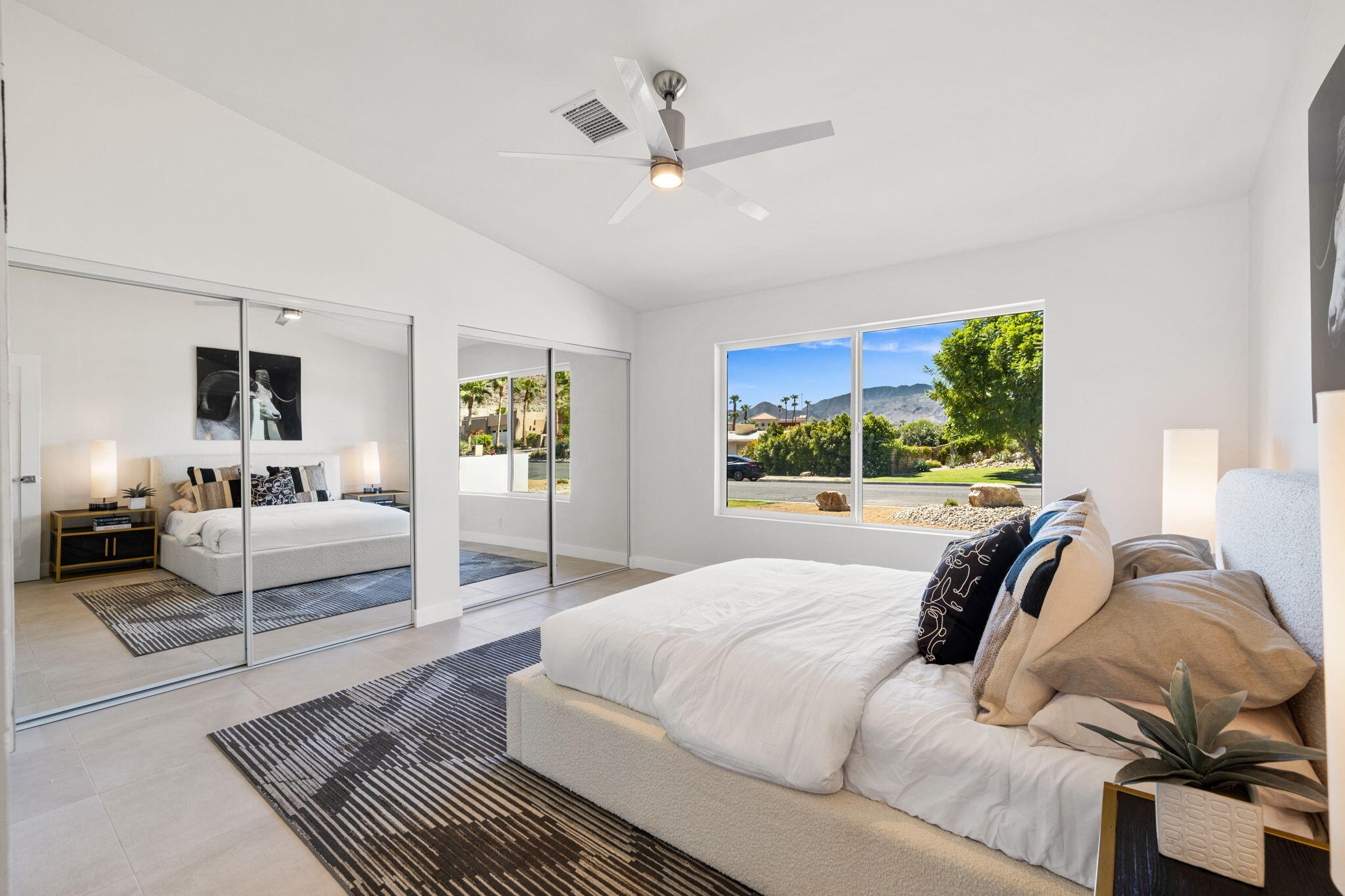 72278 Barbara Drive Rancho Mirage, CA 92270 - Photo 67 of 69 a bedroom with a bed a couch and a large window
