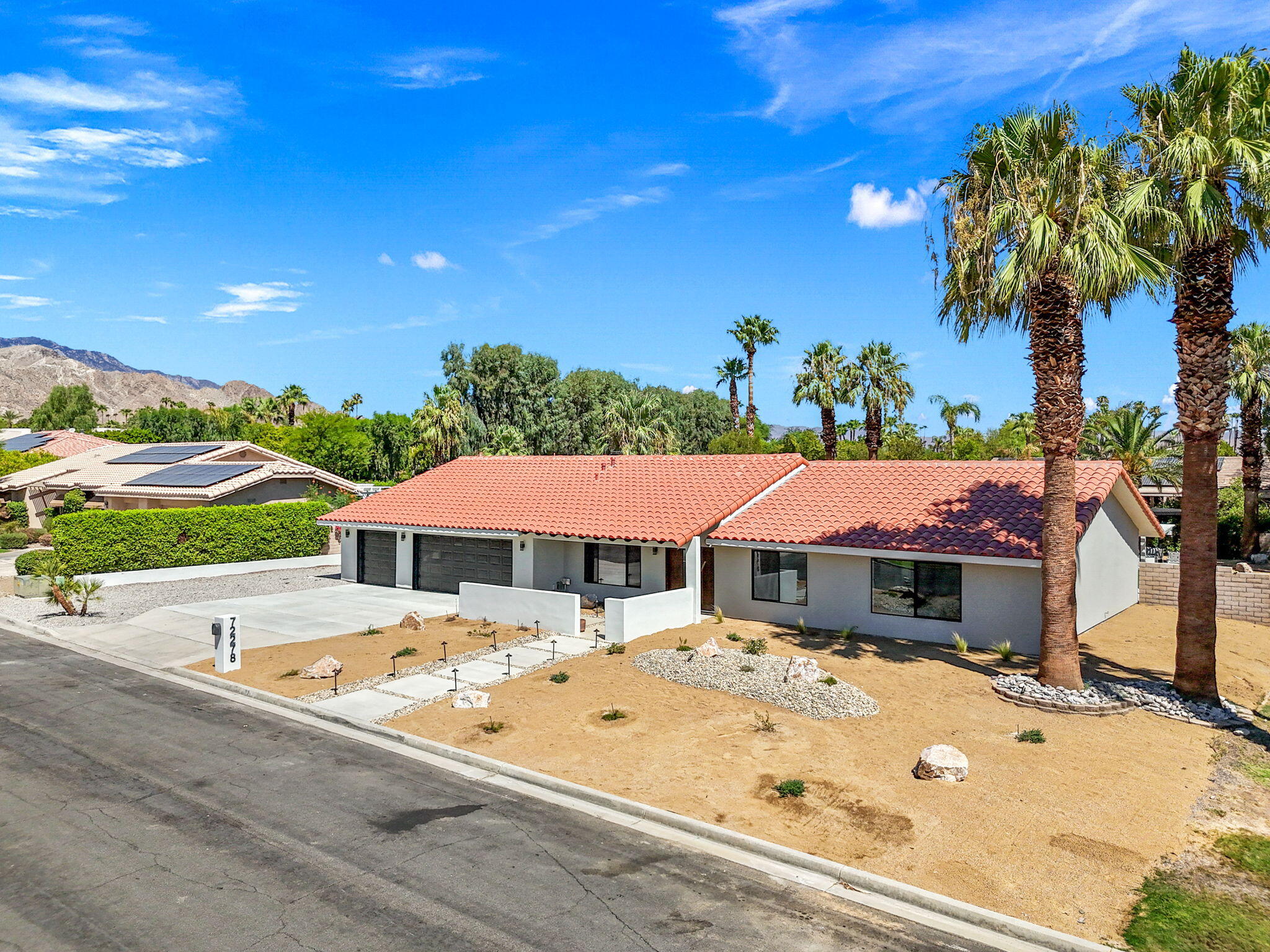 72278 Barbara Drive Rancho Mirage, CA 92270 - Photo 10 of 69 a view of a swimming pool with an outdoor space and seating area