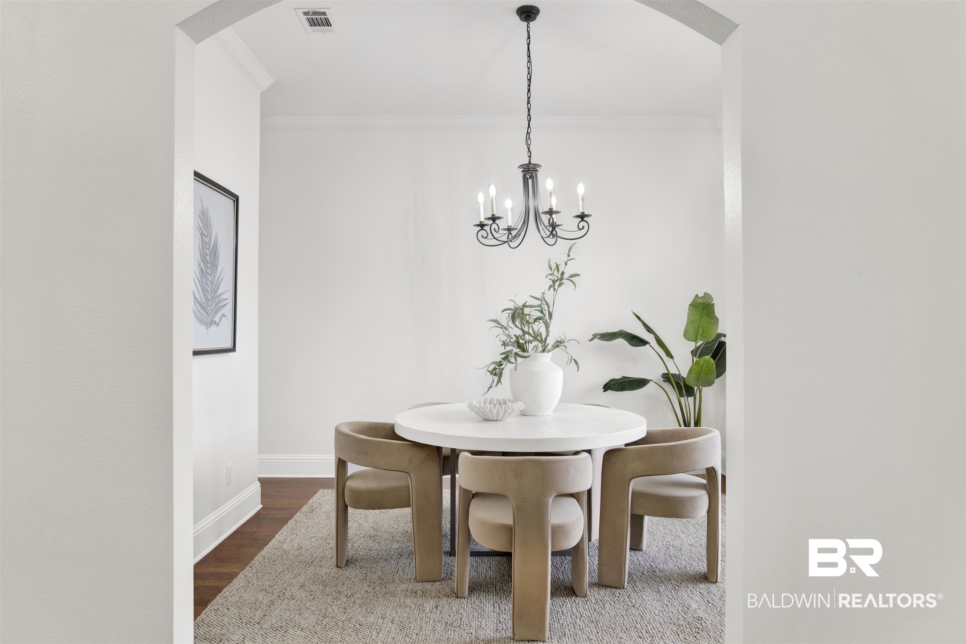 25350 Spindle Lane Daphne, AL 36526 - Photo 3 of 32 Dining space featuring a notable chandelier, dark wood-type flooring, and ornamental molding