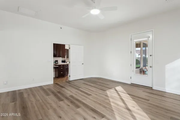 a view of a room with cabinet flat screen tv and windows
