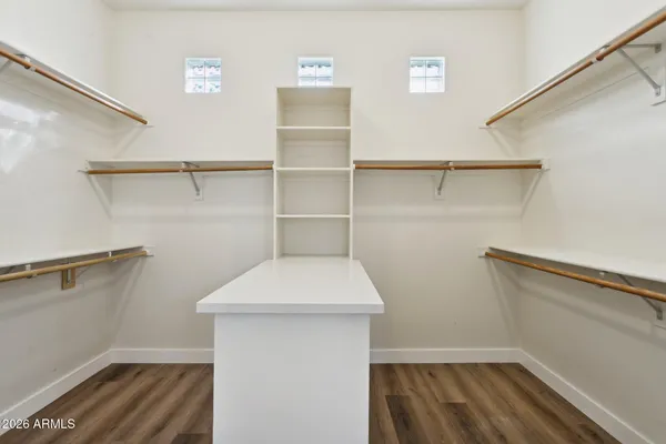a view of storage and utility room with racks on the wall