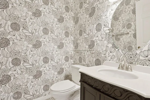 a view of a backyard with plants and a patio