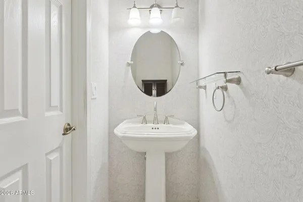 a dining room with furniture and a floor to ceiling window