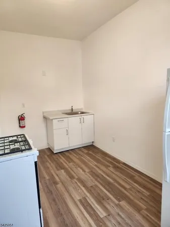 a view of kitchen and wooden floor