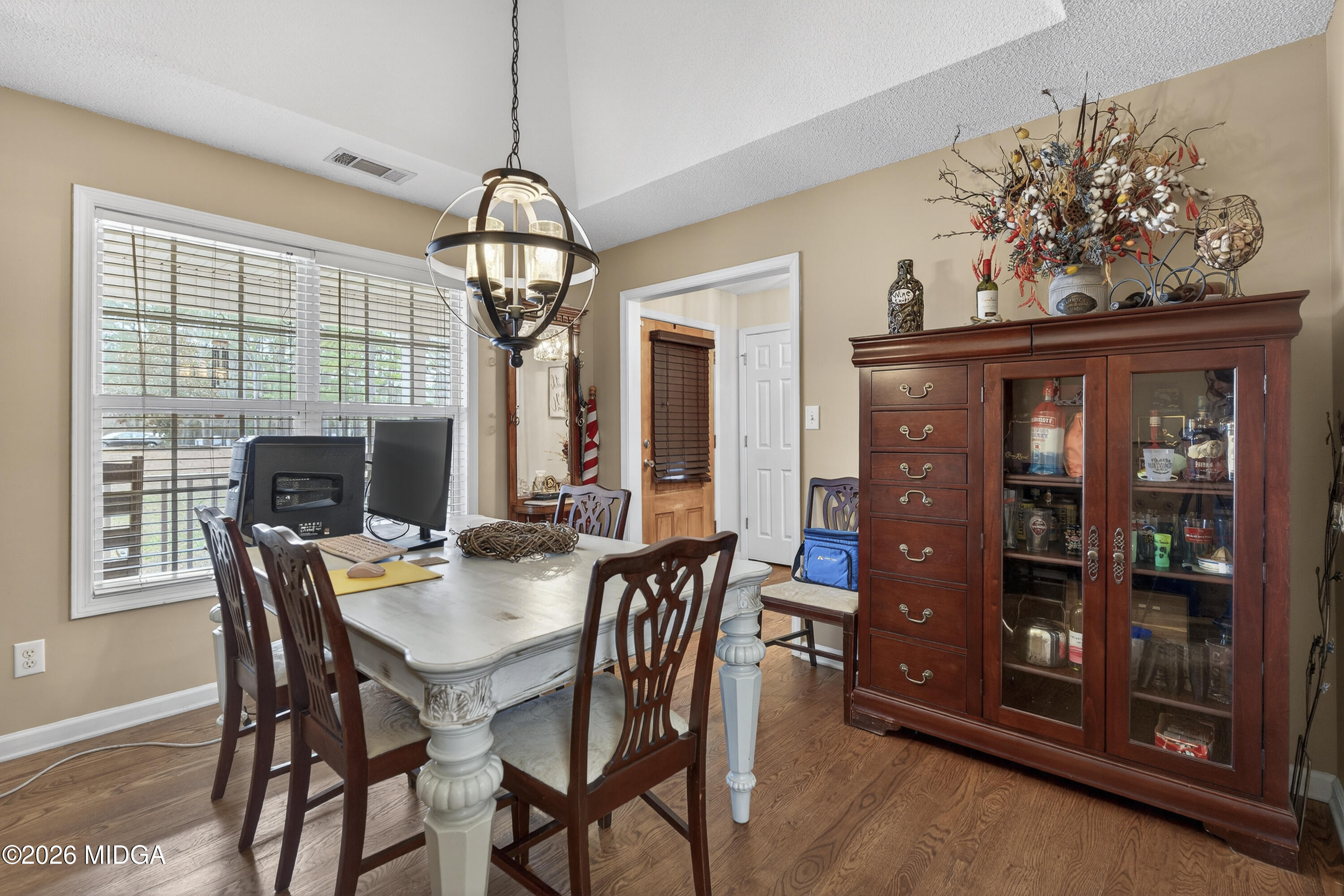 249 Southern Walk Circle Gray, GA 31032 - Photo 12 of 58 a view of a dining room with furniture wooden floor and chandelier