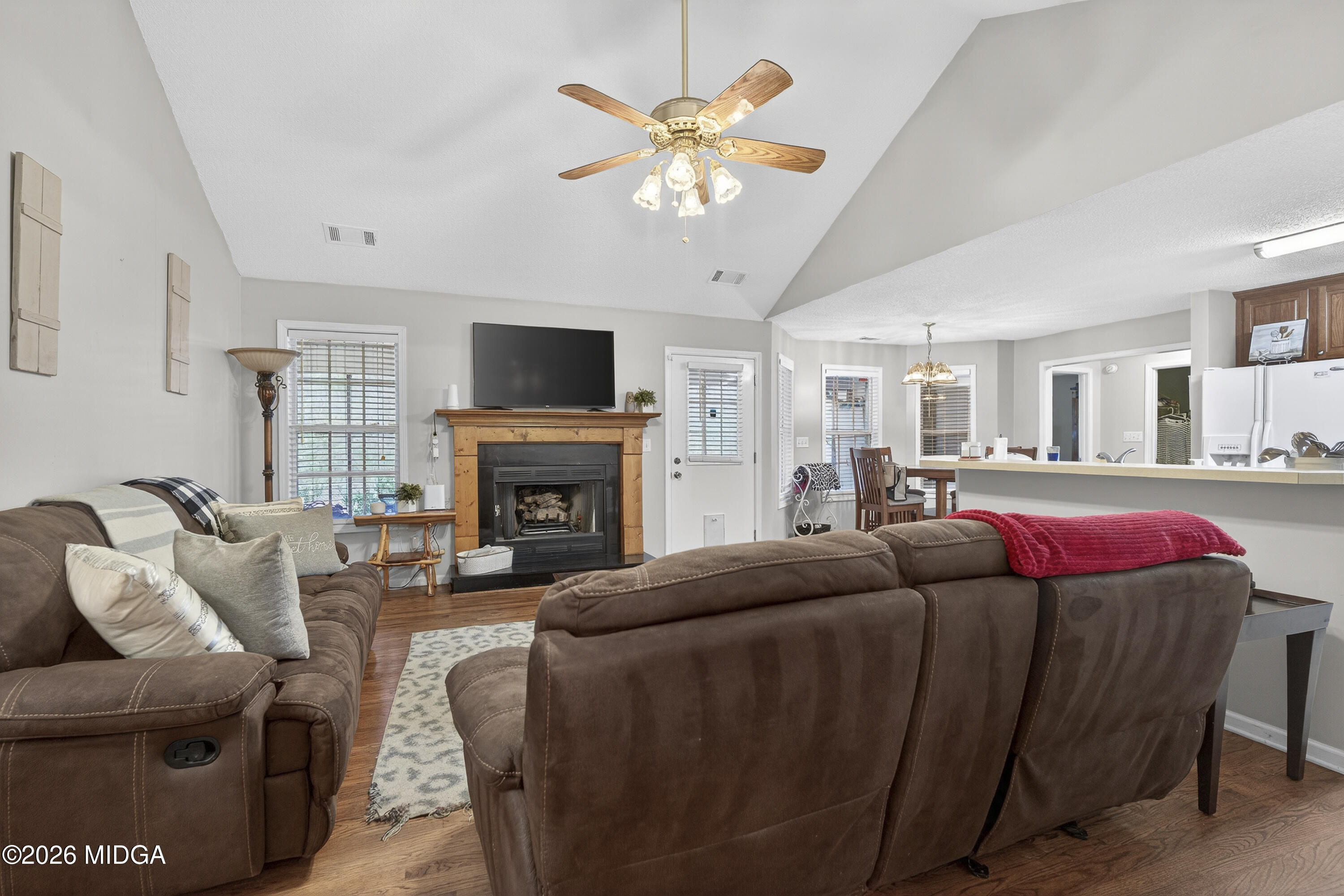 249 Southern Walk Circle Gray, GA 31032 - Photo 13 of 58 a living room with furniture a fireplace and a flat screen tv