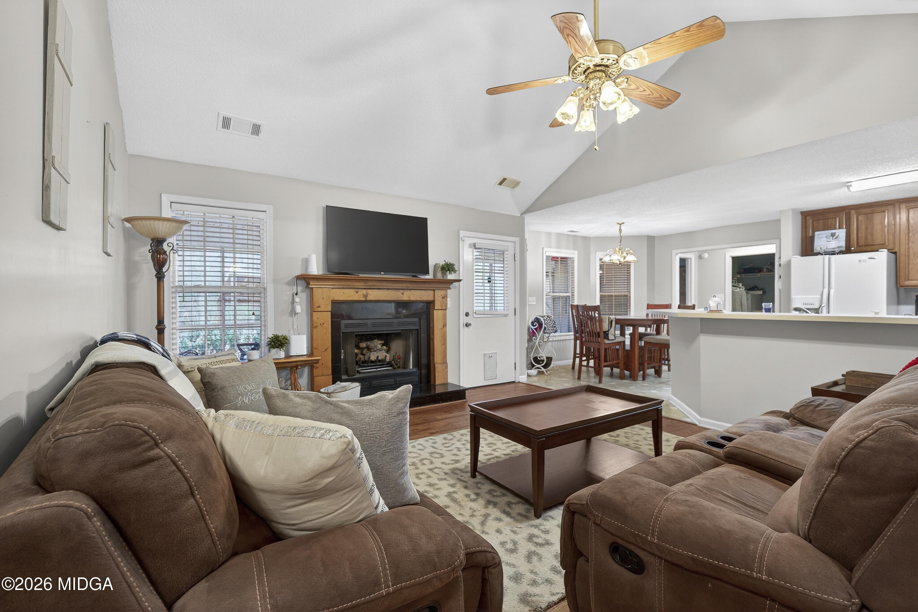 249 Southern Walk Circle Gray, GA 31032 - Photo 14 of 58 a living room with furniture a fireplace and a flat screen tv