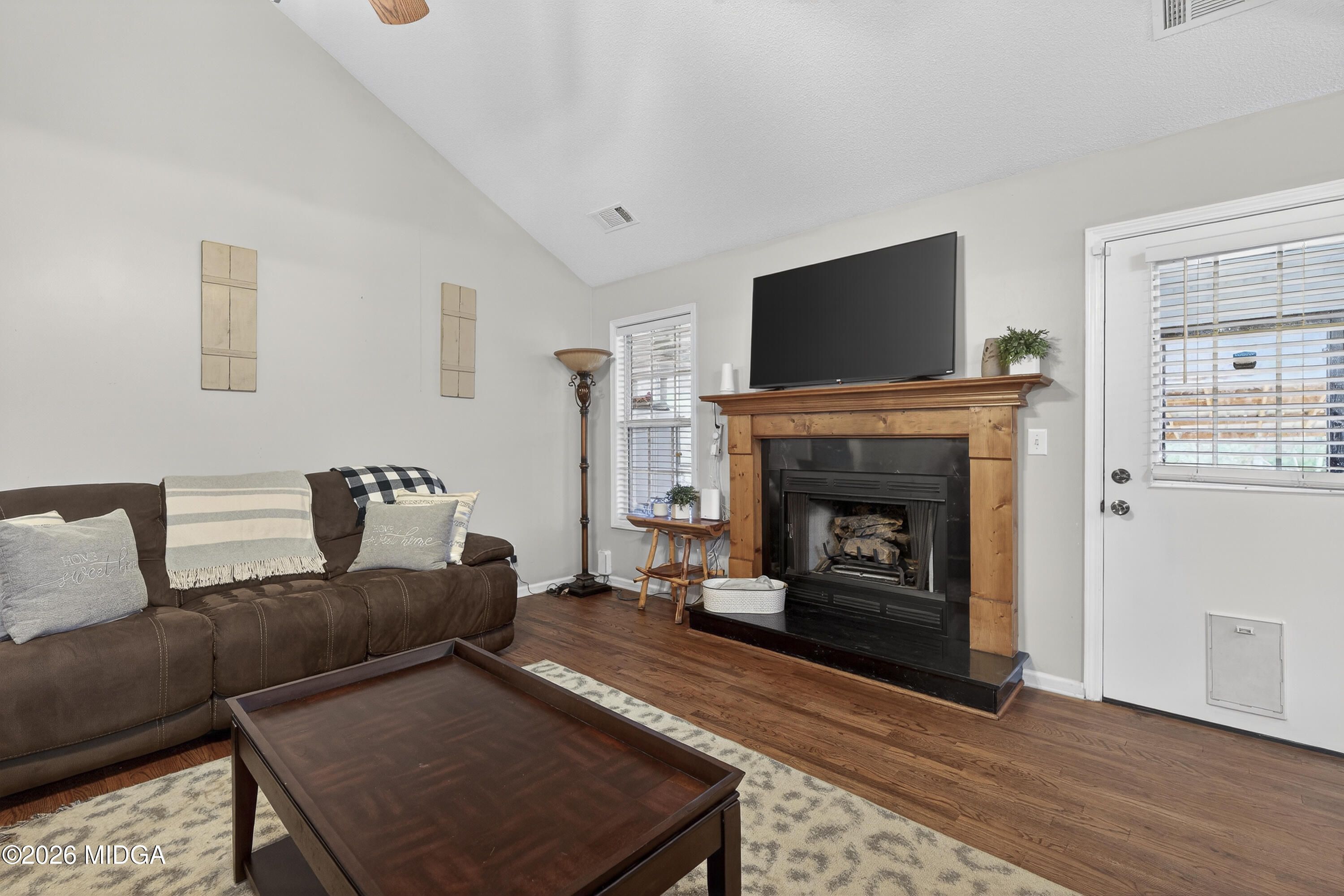249 Southern Walk Circle Gray, GA 31032 - Photo 18 of 58 a living room with furniture and a fireplace