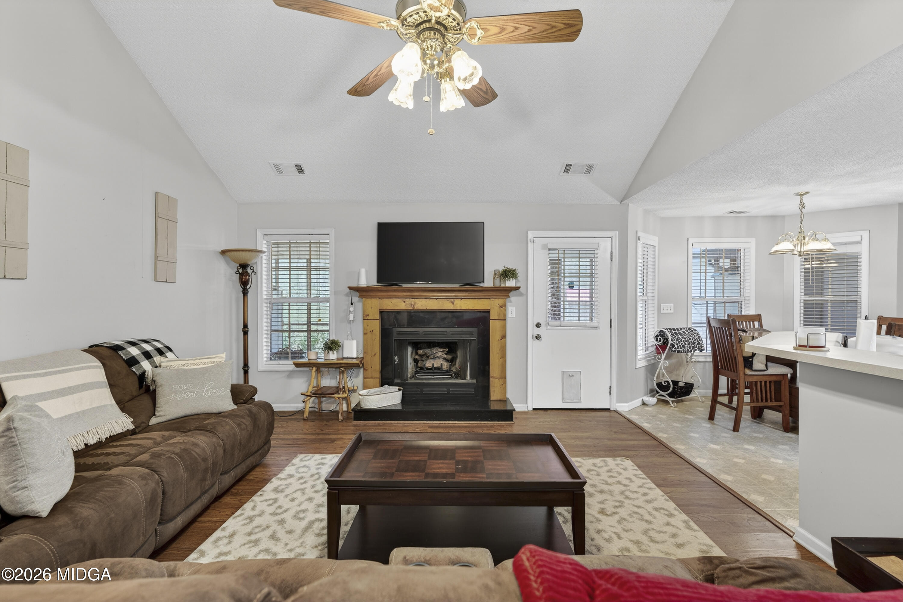 249 Southern Walk Circle Gray, GA 31032 - Photo 19 of 58 a living room with furniture a fireplace and a flat screen tv