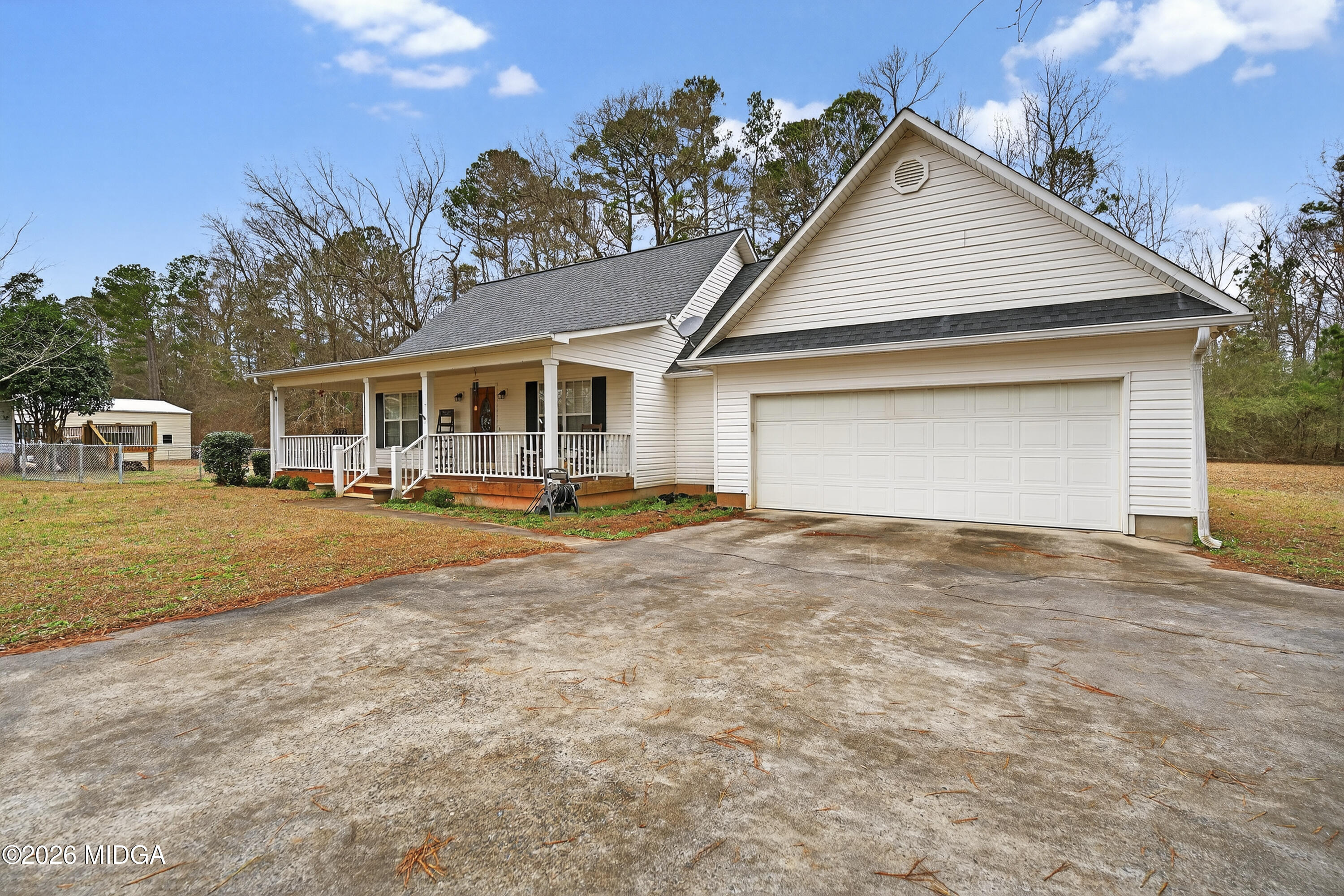 249 Southern Walk Circle Gray, GA 31032 - Photo 2 of 58 a view of a white house with a swimming pool and a yard