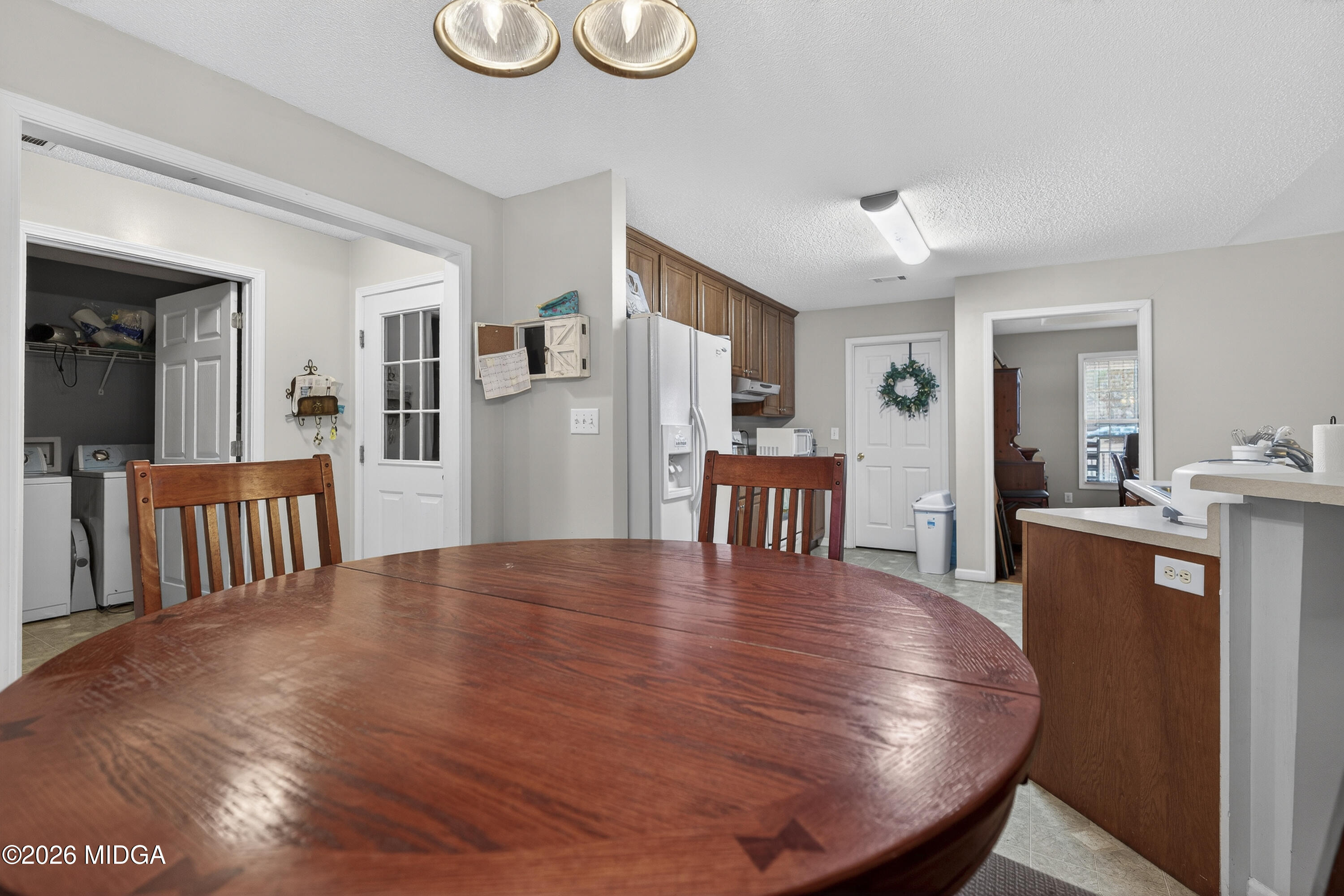 249 Southern Walk Circle Gray, GA 31032 - Photo 22 of 58 a dining room with furniture and wooden floor