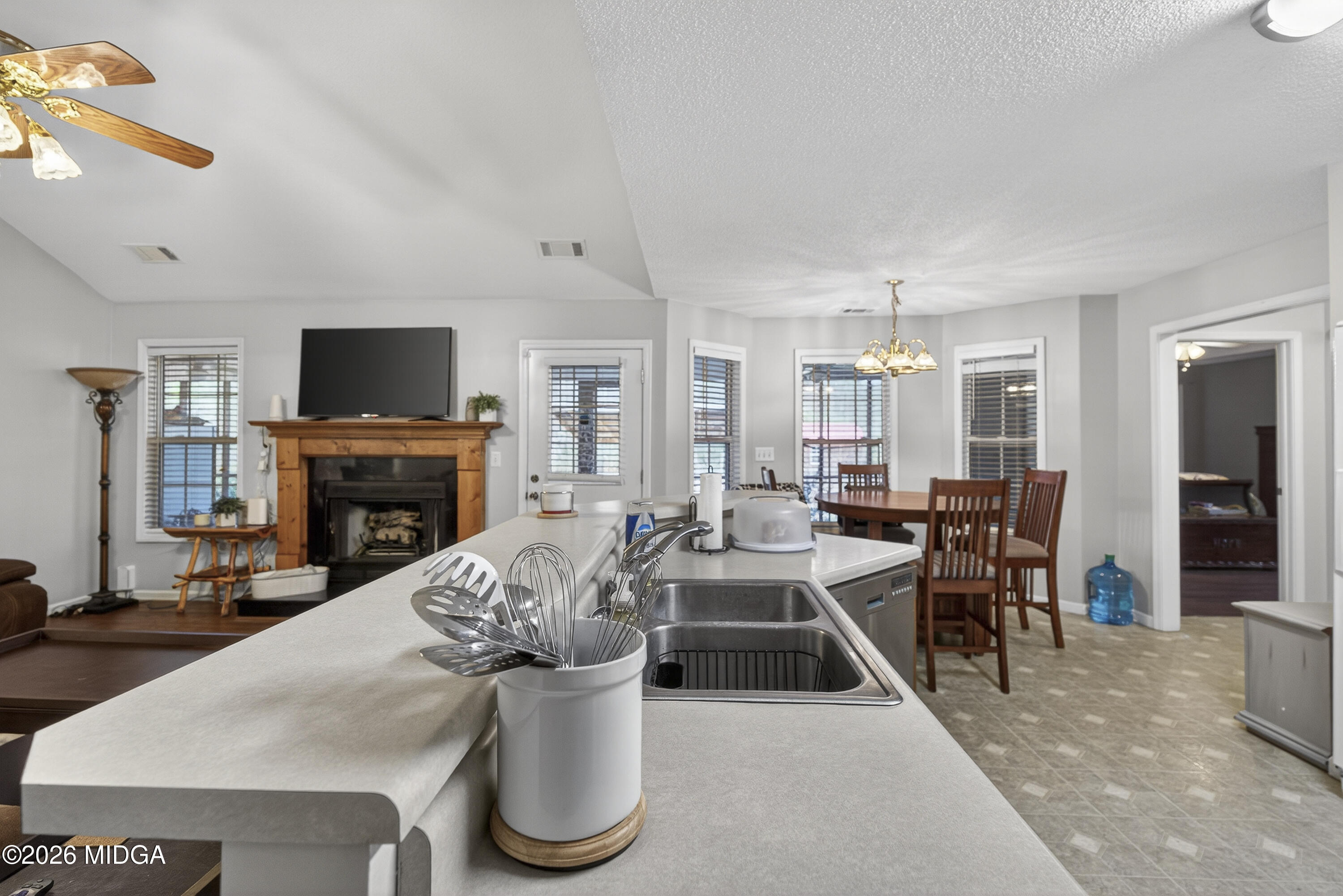 249 Southern Walk Circle Gray, GA 31032 - Photo 30 of 58 a living room with furniture a fireplace and a flat screen tv