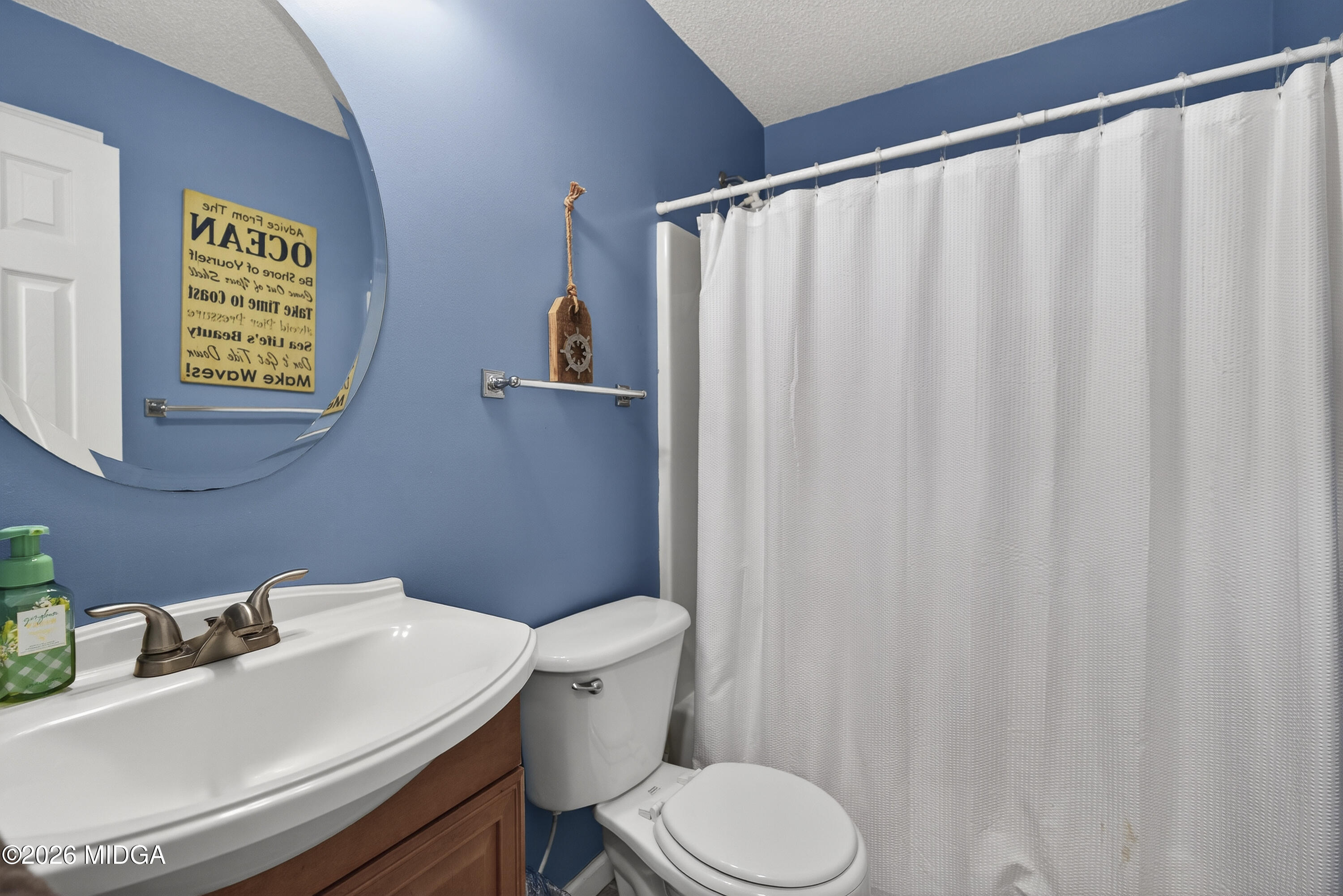 249 Southern Walk Circle Gray, GA 31032 - Photo 35 of 58 a bathroom with a sink and a toilet