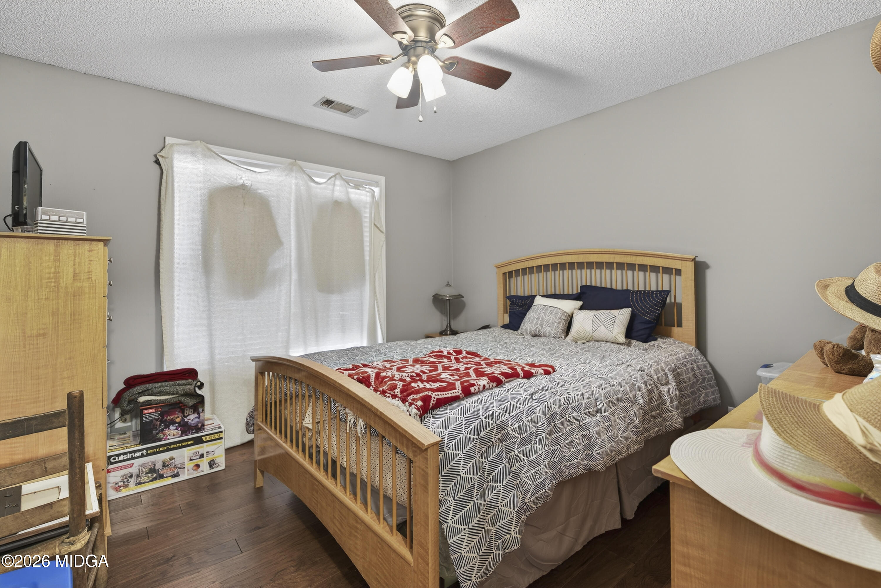 249 Southern Walk Circle Gray, GA 31032 - Photo 36 of 58 a bedroom with a bed and a chandelier